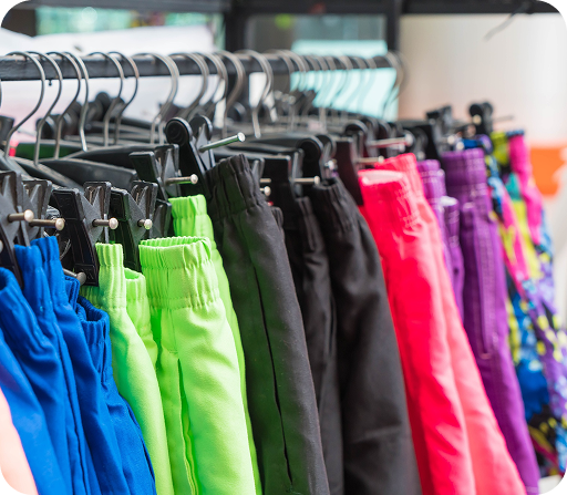 Colorful athletic shorts hanging on display rack